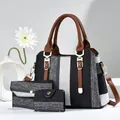 Dreiteiliges Set aus karierten Stofftaschen mit braunen Lederriemen und Streifen - Schwarz & Weiß