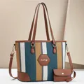 Detail of canvas striped tote with leather trim and matching mini coin purse - Green