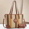 Detail of striped fabric tote bag with leather trim and gold metal logo charm - Khaki