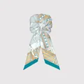 Detail of silk-like twill hair scrunchie with equestrian pattern and long streamers - Light Blue Equestrian Pattern (1)