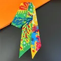 Narrow silk scarf with jungle animal and leaf patterns in green and yellow - Bright Green Nature (C267-2)