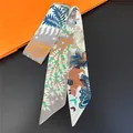 Detail of artistic jungle animal print twilly scarf with blue leaves and a brown bear - Multi Patchwork Nature (C267-5)