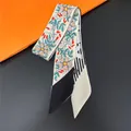 Detail of floral and geometric pattern twilly scarf with care label on modern background - Vintage Floral Geometric Patchwork (C270-1)