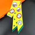Detail of yellow silk twilly scarf with horse head and heart prints on orange box - Yellow Horse Heart Style (C239-4)