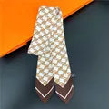 Fashionable twilly scarf with brown monogram pattern on off-white polyester fabric - 19