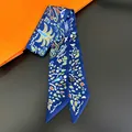Close-up of narrow polyester twilly scarf with abstract prints on a bicolor background - Navy Blue Print (C248-1)