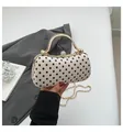 Polka dot evening clutch bag with gold handle and diamond clasp in beige and black - White