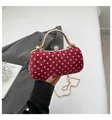 Elegant red velvet clutch with pink polka dots, gold metal handle and crystal sphere clasp - Red