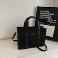Borsa tote in camoscio nero con bordi in pelle martellata e cuciture intrecciate - Taglia unica / Nero