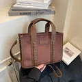 Deep brown faux suede tote bag with leather handles and embossed tote logo detail - One Size / Brown