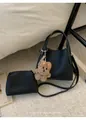 Detail of black pebbled leather bucket bag set with mini pouch and cute plush bear charm - With Pendant / Black