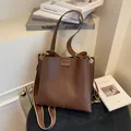 Minimalist large brown bucket bag in smooth PU leather with versatile double straps - Coffee