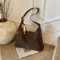 Dark brown large capacity tote bag with white stitching and beaded tassel charm - With Pendant / Light Coffee