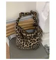 Detail of plush leopard print shoulder bag featuring a stylish scrunchie strap design - With Pendant / Leopard Brown