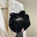 Chic black plush handbag with a large bow handle and soft faux fur moon shape - Black