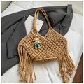 Beige hollow woven shoulder bag with fringe detail and a small doll charm pendant - With Doll Pendant / Khaki
