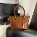 Brown vintage faux leather tote bag with gold logo and colorful beaded pendant - With Pendant / Brown