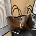 Large dark brown vintage tote bag with leather texture and wooden bead tassel detail - With Pendant / Brown