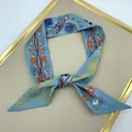 Detail of light blue silk twilly featuring abstract floral patterns and a decorative knot - Sky Blue Printed Style (T391-3)