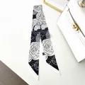 Detail of black and white camellia pattern skinny scarf wrapped on luxury bag handle - Black And White Camellia Style (C201-1)