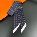 Navy blue twilly scarf with white D-pattern print and orange luxury gift box background - Navy Blue Background White Letters (C217-3)