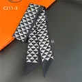 Close-up of geometric silk twilly scarf with diamond patterns and pointed edges - Black/Gray (C211-3)