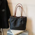 Black large capacity waterproof nylon tote bag with brown straps on silver suitcase - Large / Black
