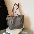 Waterproof grey nylon tote bag with brown leather straps for commuting and travel - Large / Gray