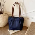 Dark blue waterproof nylon tote bag with pleated design and brown leather straps - Large / Blue