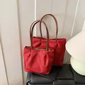 Red nylon pleated tote bags in two sizes with brown leather handles and gold zippers - Large / Red