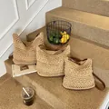 Three sizes of woven straw shoulder bags in natural color with brown leather straps - Large / Khaki