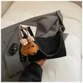 Black canvas hobo bag with teddy charm and shoulder strap for versatile wear - With Pendant / Black