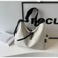 Cream white crossbody gym bag with wide black strap and modern double zipper design - One Size / Off White