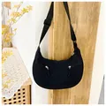 Detail of black nylon crescent bag with double zipper pockets and adjustable strap - One Size / Black