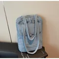 Light blue quilted laptop tote bag with multi-pocket design and soft padded handles - One Size / Blue