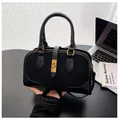 Minimalist black suede tote bag with golden metal rotary lock and adjustable shoulder strap - One Size / Black