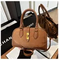 Brown faux suede doctor bag with leather trim and gold metal twist lock closure - One Size / Brown