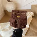 Quilted dark brown backpack with metallic chain straps and diamond stitching pattern - One Size / Coffee
