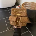 Brown quilted backpack with golden chain and front pockets in vintage suede finish - One Size / Brown