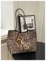 Leopard print tote bag with brown straps and beaded charm detail on a studio table - With Pendant / Khaki