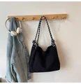Minimalist black corduroy crossbody bag with stylish black and white braided rope handles - Black