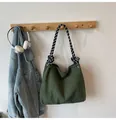 Green corduroy shoulder bag with black and white checkered braided rope handles - Green