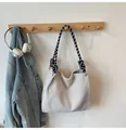 Minimalist beige corduroy crossbody bag with stylish black and white checkered strap - Off White