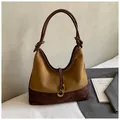 Close-up of suede shoulder bag with caramel and brown colors and golden ring detail - Brown No Pendant