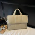 Beige quilted puffer tote bag with zipper closure and spacious padded shoulder strap - Off White