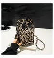 Quirky leopard print coffin shaped crossbody bag with black eye patches and metal strap hooks - Leopard Print