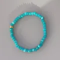 Detail view of faceted turquoise beads bracelet with decorative golden metal rings - One Size / Lake Blue Cut Natural Stone Style (6) / 17+3cm