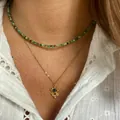 Close-up of layered necklace set featuring green beads and a golden evil eye pendant - Necklace / 38+5cm / Camo Green