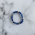 Detailed macro view of handmade beaded ring with blue faceted natural stones and gold beads - Blue Faceted Stone Beads Style (B Ring)