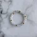 Detail of beaded ring featuring faceted grey natural stones and gold metal spacers - Miniature Translucent Gray Natural Stone Style (H Ring)